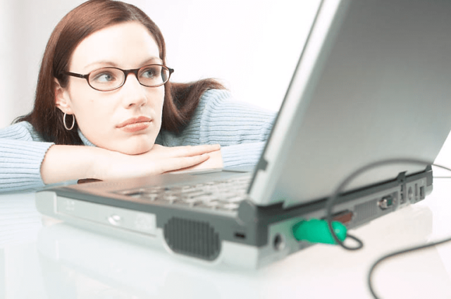 Woman using watching laptop computer screen uid
